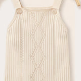 Knitted overall combined with beige bodysuit