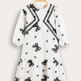 Tiered dress with bow ties - black