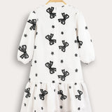 Tiered dress with bow ties - black