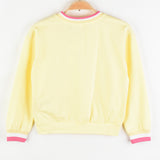Girl's shirt with crocheted flower - yellow