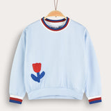 Girl's shirt with crocheted flower - blue